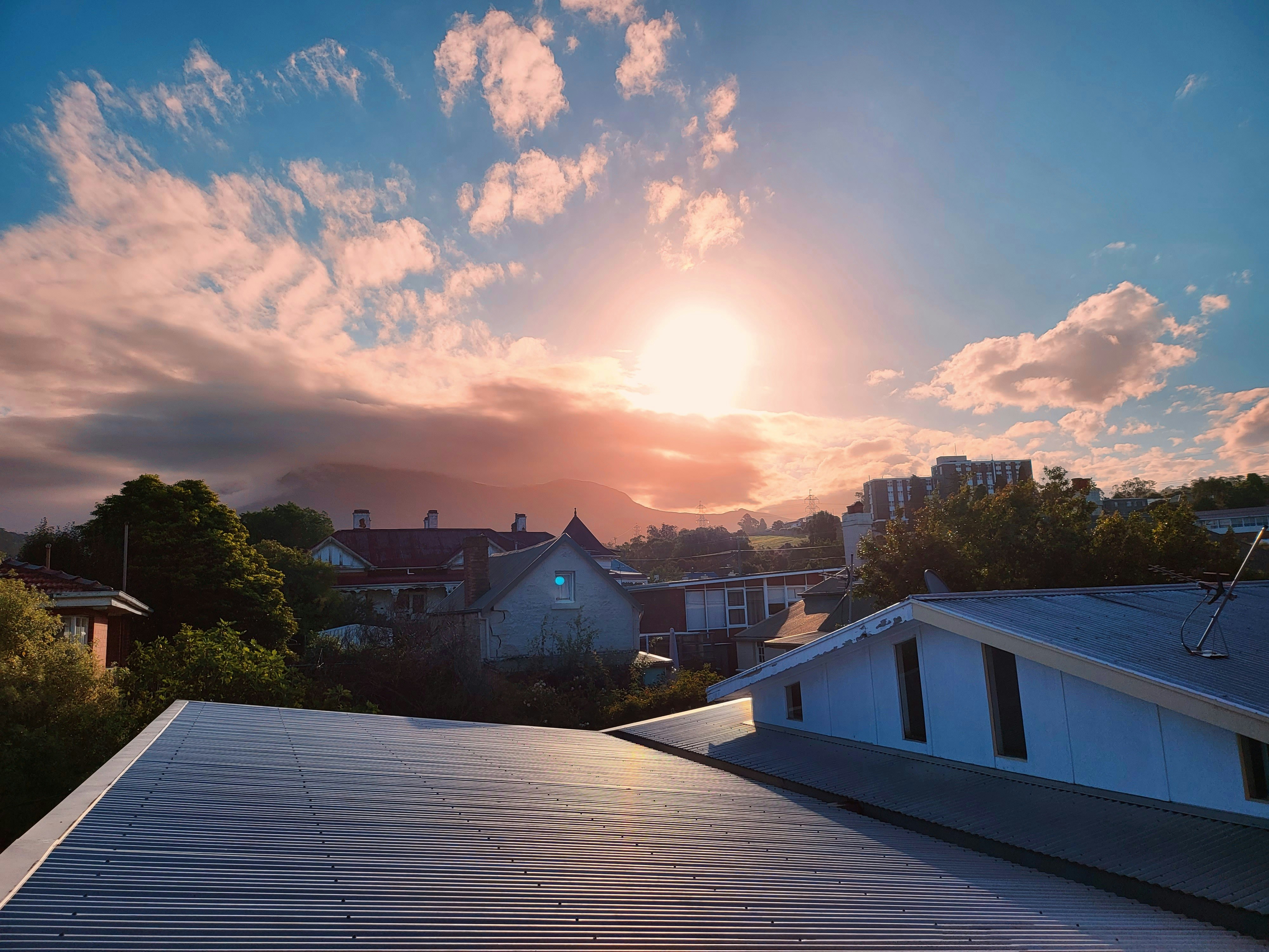 Sunrise over the rooftops of a residential neighborhood
